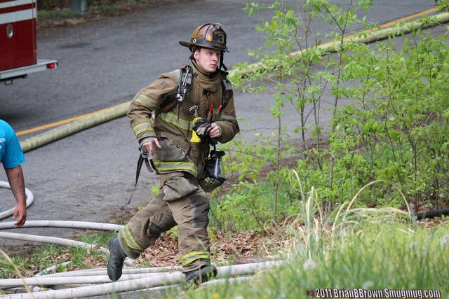 FF McCarthy sprinting to the fire.